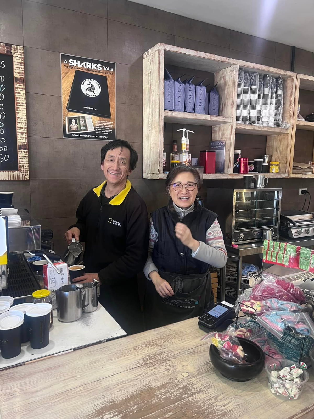 The owners of Narrabeen Sandwich Delite behind the counter